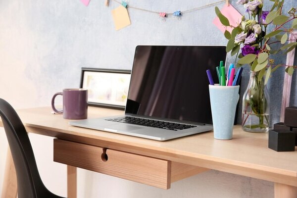 A bright workspace with a laptop and a calm, tidy desk